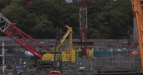 A cityscape of moving crane at the under construction in Shinagawa Tokyo telephoto