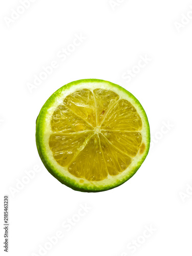 Fresh Juicy Green Lemon Slice Macro Shot Isolated on Black Background. Slice of lime.

