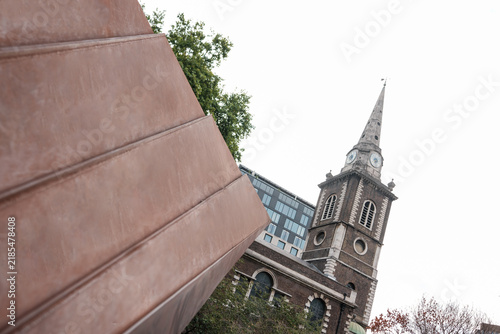 Photography St luke's old street church steeple contrasting with modern sculpture