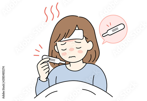 woman in bed checking a thermometer with a high fever of 38.5 degrees.
