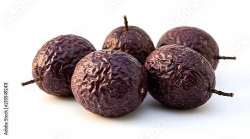 Fresh purple passion fruits arranged on white background