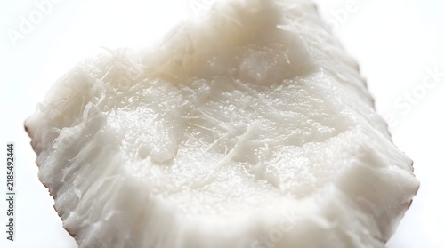 Fresh raw coconut meat macro detail with moist texture and white surface