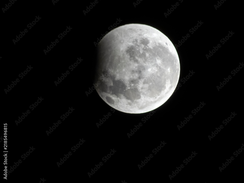 Obraz premium A close-up shot capturing the stunning partial lunar eclipse during the night of August 27 to 28, 2026, as seen from the southern hemisphere in Brazil. 