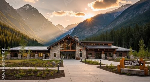 A modern visitor center stands prominently in a scenic national park. The building features a large wooden entrance with windows and a sign that reads 