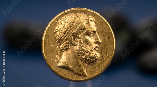 Ancient gold coin featuring a profile portrait of a bearded Greek philosopher.