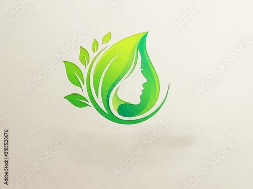 Eco-friendly green leaf logo design featuring a woman's silhouette for organic beauty brands and wellness concepts