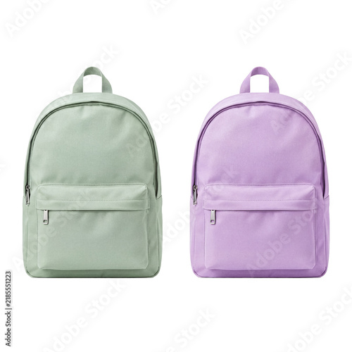 Two colorful backpacks, one light green and one purple, standing side-by-side on a transparent background.