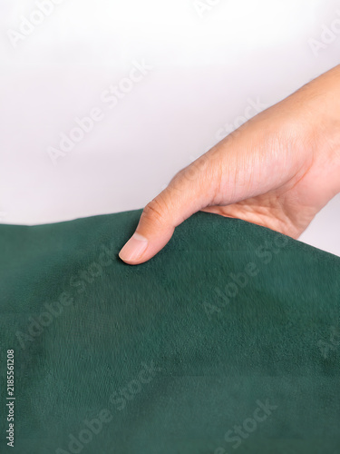 hand holding a green card