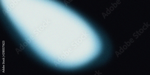 Abstract blue glowing light effect with soft blurred illumination spreading diagonally across a dark background
