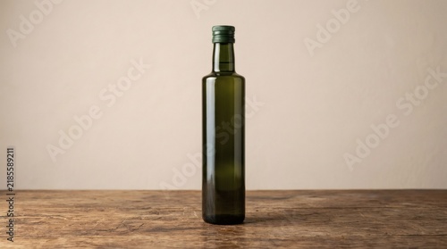 Rustic glass bottle on wooden table, minimalist dark green container for essential oil, product mockup with ample copy space for branding