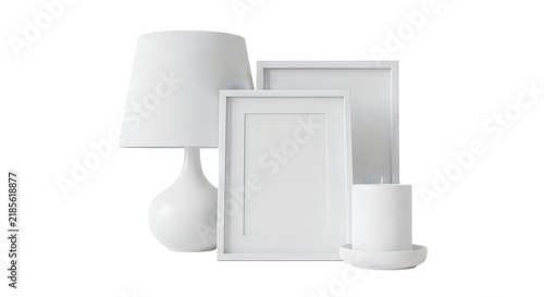 White table lamp with empty picture frames and a candle isolated on a clean white background