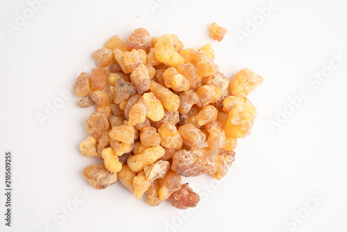 Frankincense or olibanum aromatic resin isolated on white background used in incense and perfumes.
