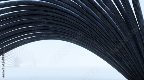 Abstract close up of black industrial steel cables forming a curved geometric pattern