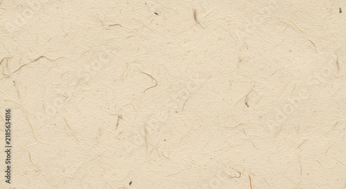 Textured beige paper background with subtle fibers