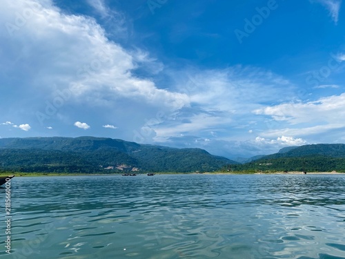 Beautiful Mountain Lake Landscape with Blue Water and Dramatic Clouds