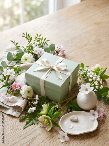 Elegant table setting with greenery and white tableware