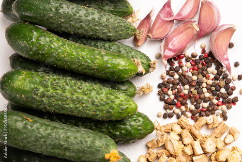 Fotografie Ingredients for pickled cucumbers layout top view