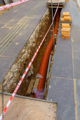 Construction site with exposed pipes and bricks