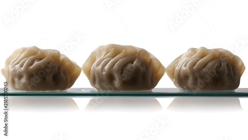 A collection of perfectly steamed dumplings featuring elegant folded pleats and a soft delicate texture, isolated on a transparent background.