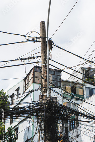 Canvastavla Utility pole entangled with wires in urban setting