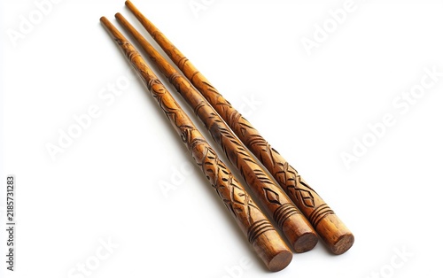 Indigenous Australian Clapsticks with Decorative Carvings Isolated on white background.
