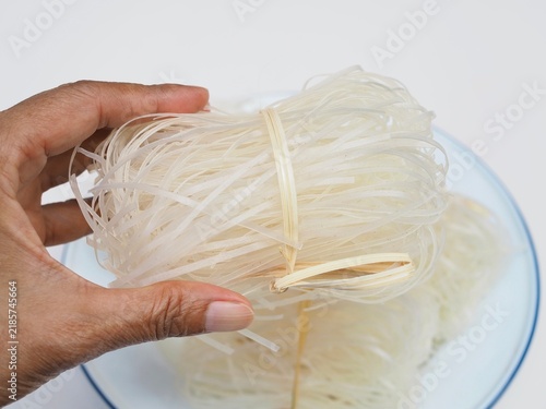 Fotografie Korat-style stir-fried rice noodles served on a plate against a white background; a signature dish of Nakhon Ratchasima Province, Thailand