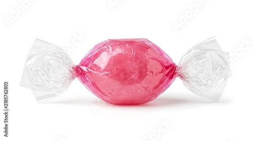 Single Pink Hard Candy Wrapped in Transparent Plastic Isolated on White Background.