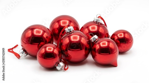 A Group of Shiny Red Christmas Ornaments Isolated on White Background.