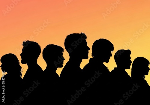 Silhouettes of a diverse group of people standing together against a sunset sky