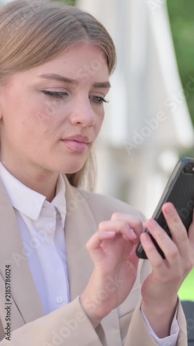 Outdoor Young Businesswoman Browsing internet on Smartphone, Text Messaging, Vertical Video