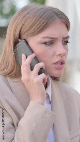 Outdoor Angry Young Businesswoman Talking on Phone, Vertical Video