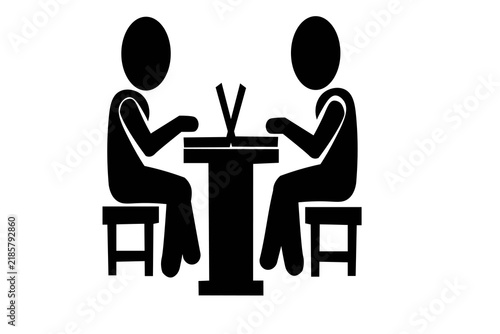 Two people chatting over a small table isolated on white background
