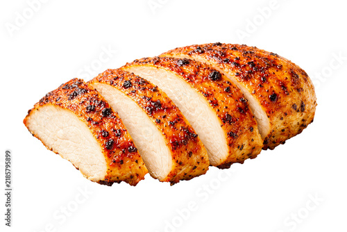 Grilled sliced chicken breast isolated on transparent background with crispy seasoned surface