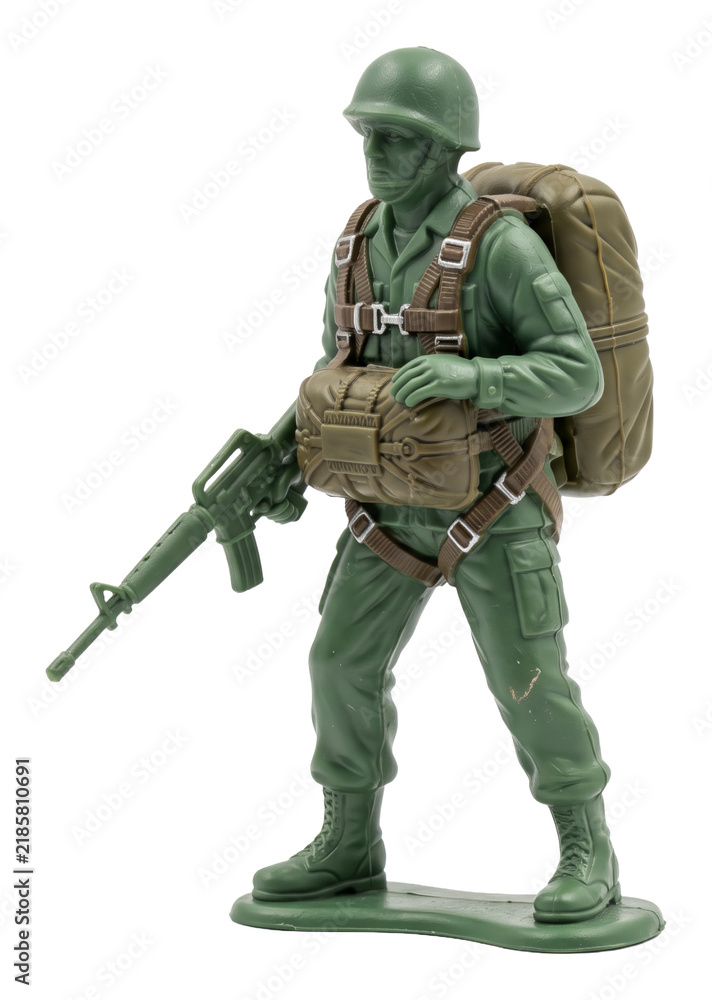 Obraz premium Plastic soldier figurine standing with rifle and backpack