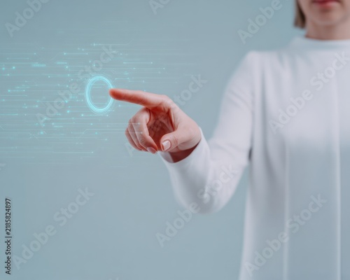 Person touching glowing digital interface button with copy space for technology concept representing innovation and future software user experience design