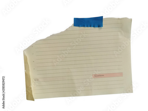 Konstfotografi A small piece of ripped paper with handwritten text notes and a blue adhesive ta