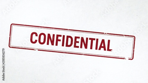 Obraz na płótnie Confidential red stamp on blurred background