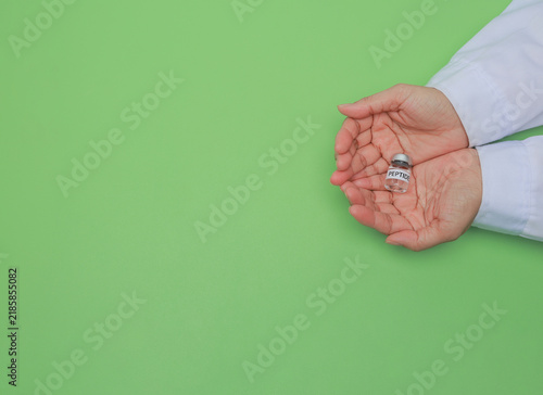 Foto Dedicated scientist hand holding medical peptide vial with careful hope during l