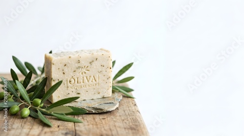Natural Soap Bar with Olive Branch on Rustic Wood