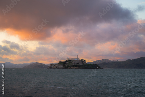 Alcatraz island at colorful sunset. Copy space travel banner 
