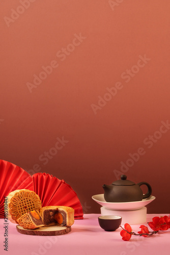 Traditional mooncakes and tea set with copy space for Mid-Autumn Festival concept