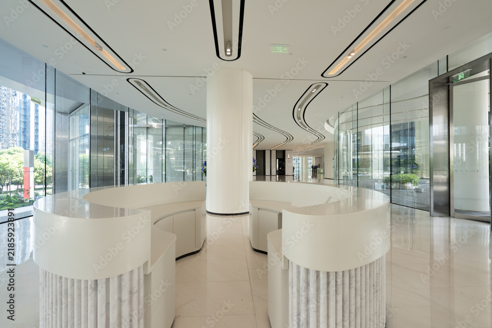 Obraz premium Modern office building lobby white curved reception desk