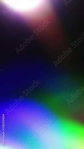 Multicolored real organic light leaks burst overlays. Vibrant prism effects with vintage film grain. Abstract glows on black background.