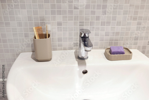 Ceramic mosaic tiles wall background in renovated bathroom.