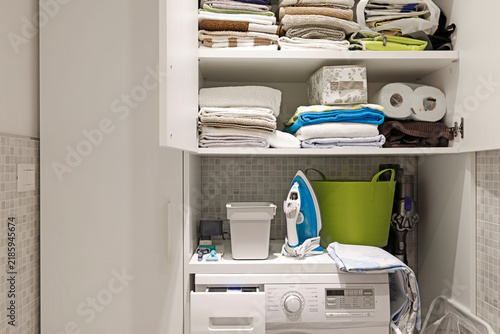 Home laundry cabinet organization and smart storage solutions.