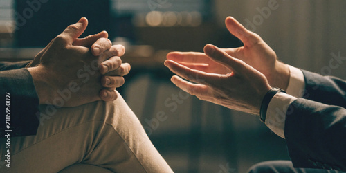 Business connections and effective communication with a close up of the hands of two business people consulting each other.