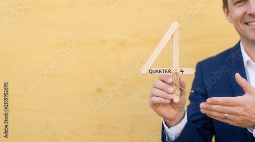 Man Holding Craft Stick Figure Quarter Four Symbol
