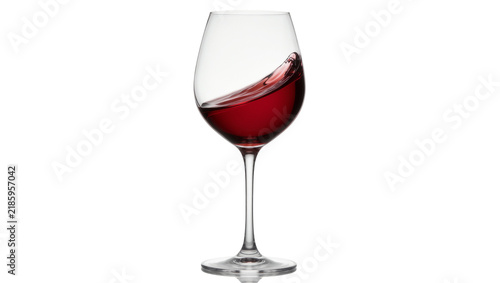 Obraz na płótnie Red wine splashing inside a clear glass goblet, isolated on transparent backgrou