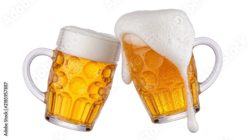 Konstfotografi Two frothy beer mugs clinking together, isolated on transparent background