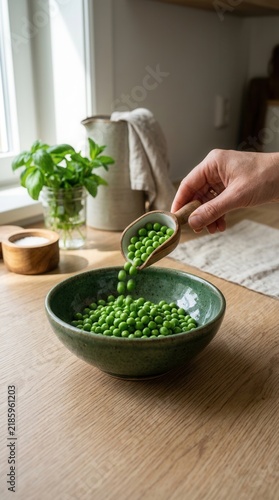 Fresh Green Peas Being Scooped Into A Rustic Bowl